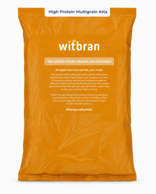 A large orange bag of witbran High Protein Multigrain Atta flour, featuring white branding and product details on a clean white background.