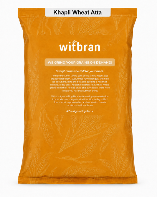 A large orange bag of Witbran Khapli Wheat Atta, featuring white branding and product details on the front, set against a clean white background.